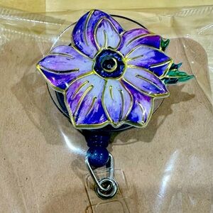 Purple flower badge reel with belt clip